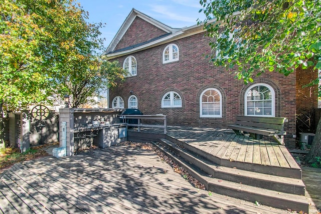 view of front of property featuring exterior kitchen and a deck