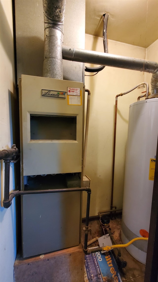 utility room with gas water heater