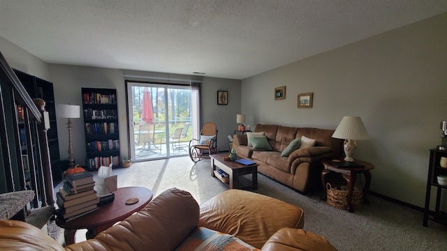 living room featuring a textured ceiling and carpet flooring