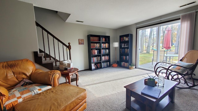 sitting room with carpet and a wealth of natural light