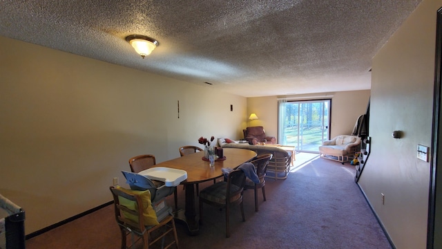 carpeted dining area with a textured ceiling