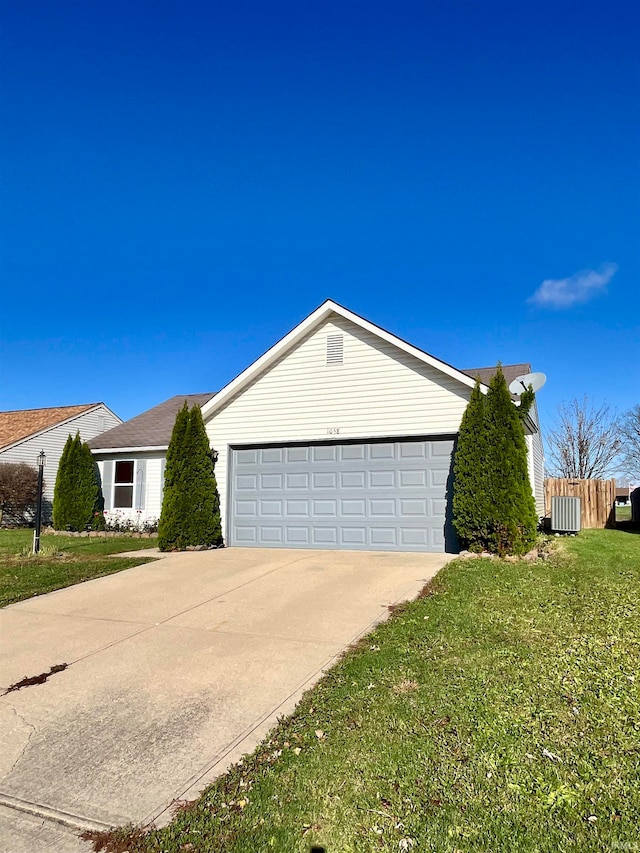 view of front facade with a garage and a front lawn