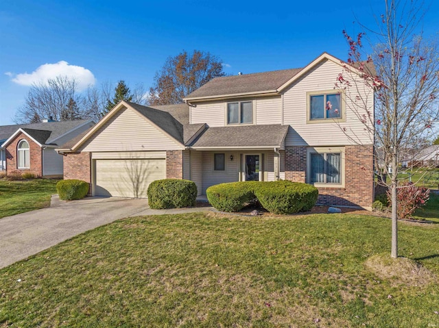 view of property with a front yard and a garage