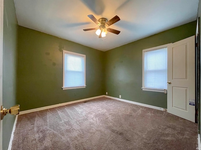 carpeted empty room with ceiling fan