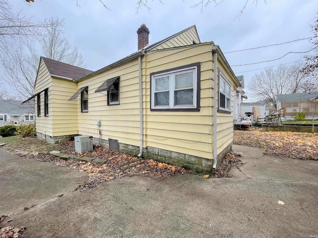 view of side of property featuring cooling unit