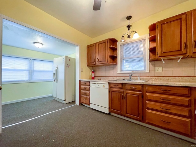 kitchen with backsplash, pendant lighting, white appliances, and dark colored carpet