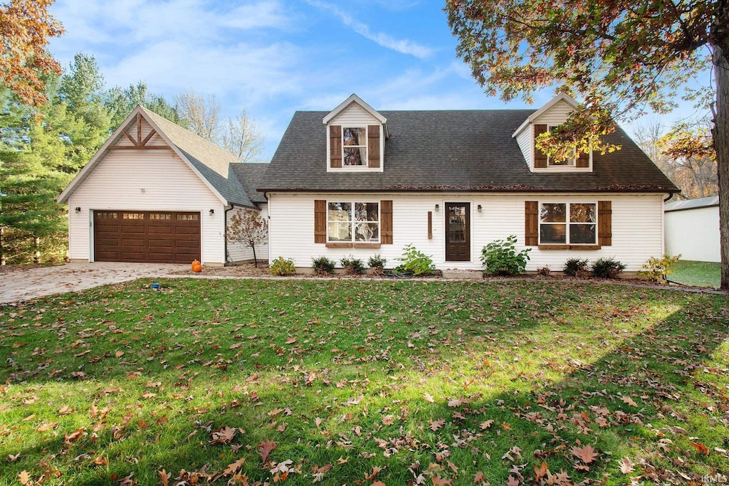 view of front of house featuring a garage and a front lawn