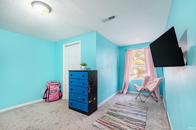 interior space featuring a textured ceiling