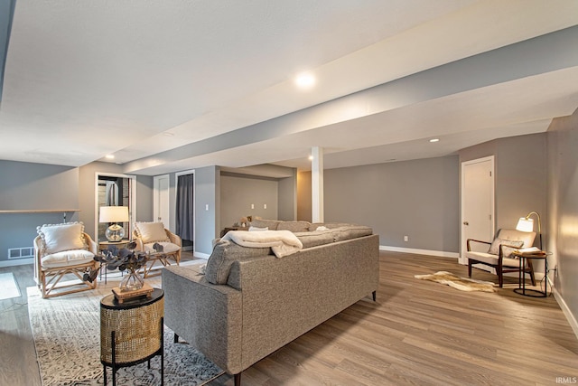 living room with light hardwood / wood-style flooring