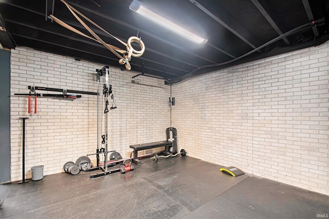 exercise area with brick wall