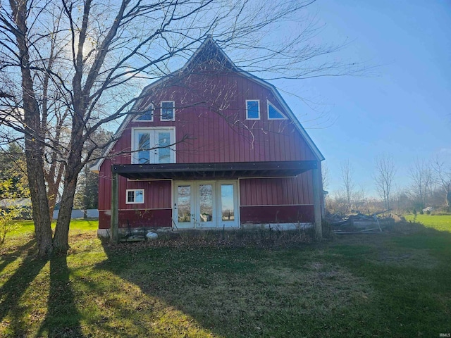 view of side of property with a yard