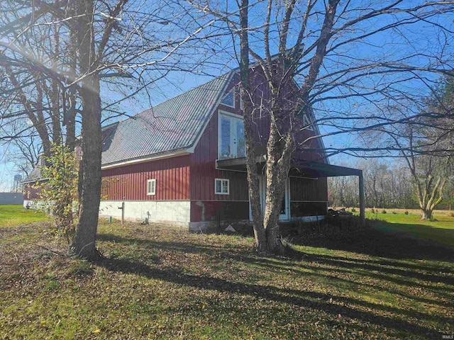 view of property exterior with a lawn