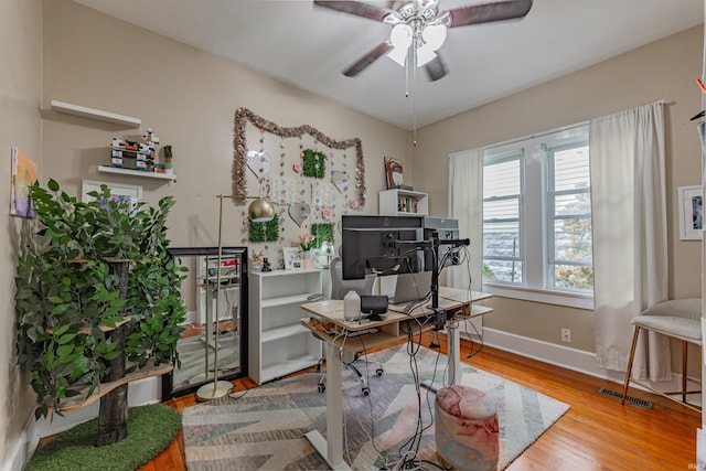 office featuring hardwood / wood-style floors and ceiling fan