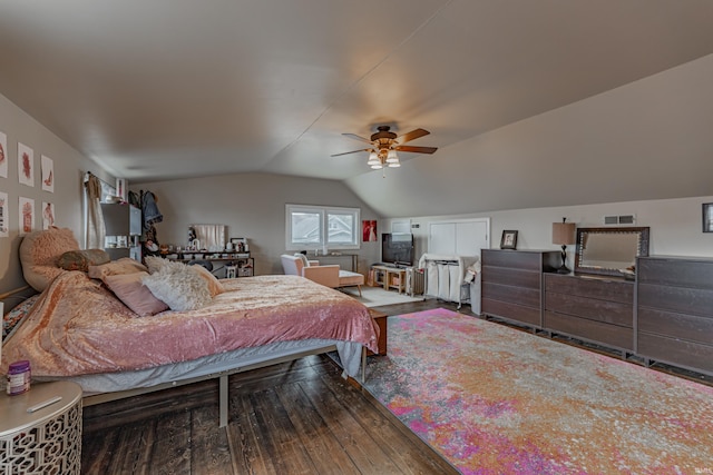 bedroom featuring hardwood / wood-style flooring, vaulted ceiling, and ceiling fan