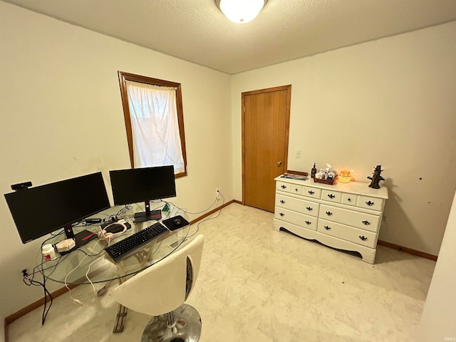 carpeted office with a textured ceiling