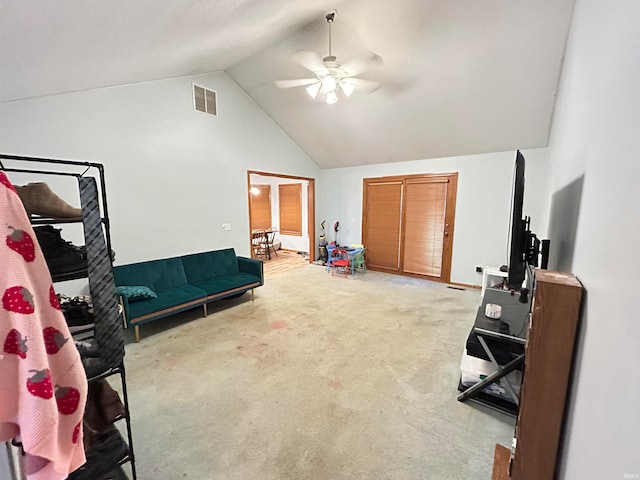 interior space with lofted ceiling, ceiling fan, and carpet floors