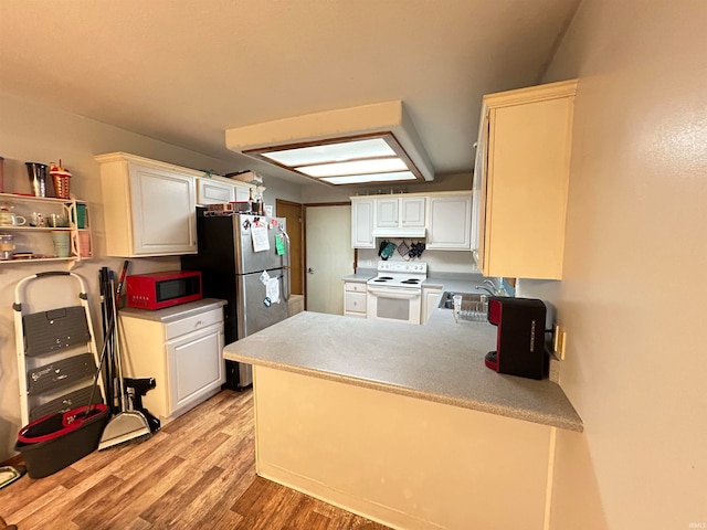 kitchen featuring white cabinetry, light wood-type flooring, kitchen peninsula, and white electric range oven