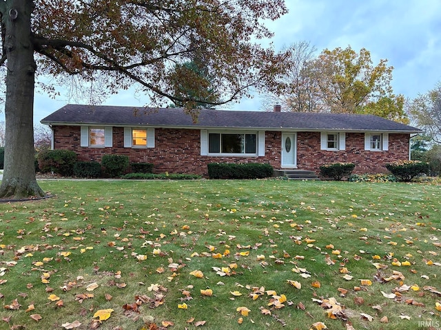 ranch-style home featuring a front yard