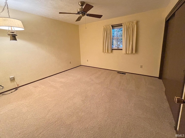 unfurnished bedroom with carpet and a textured ceiling