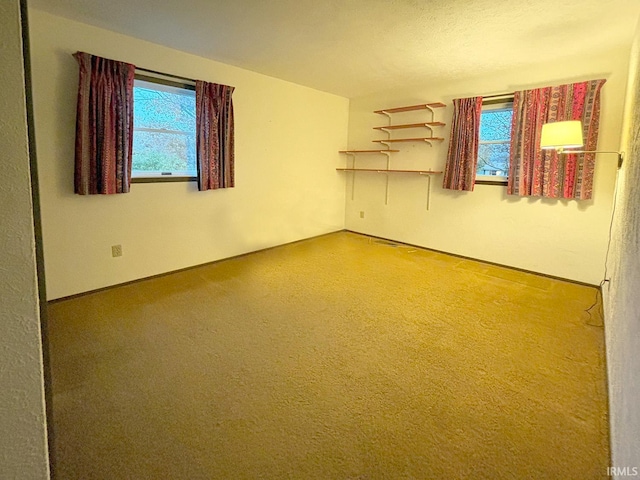 unfurnished room with a textured ceiling