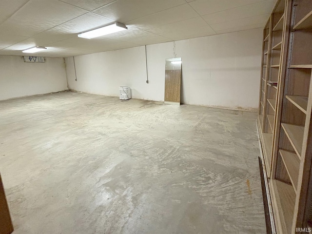 basement featuring a paneled ceiling