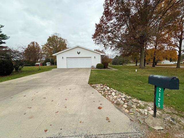 view of side of home with a garage, a yard, and an outdoor structure