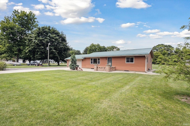 back of property featuring a yard