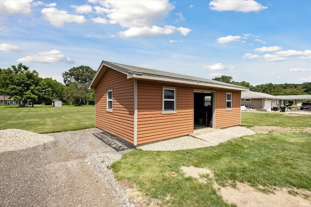 view of outdoor structure with a lawn