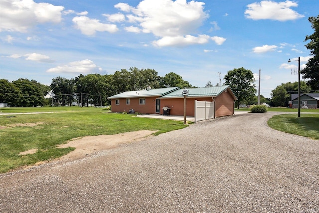 view of front of home with a garage and a front yard