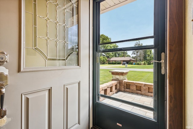 doorway to outside featuring a healthy amount of sunlight