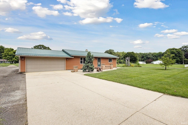 ranch-style home with a garage and a front yard