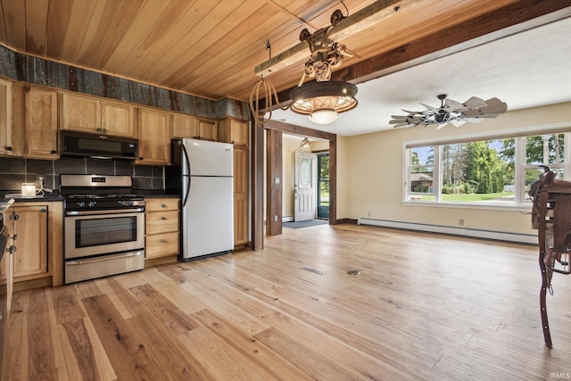 kitchen with a baseboard heating unit, tasteful backsplash, gas stove, ceiling fan, and white fridge