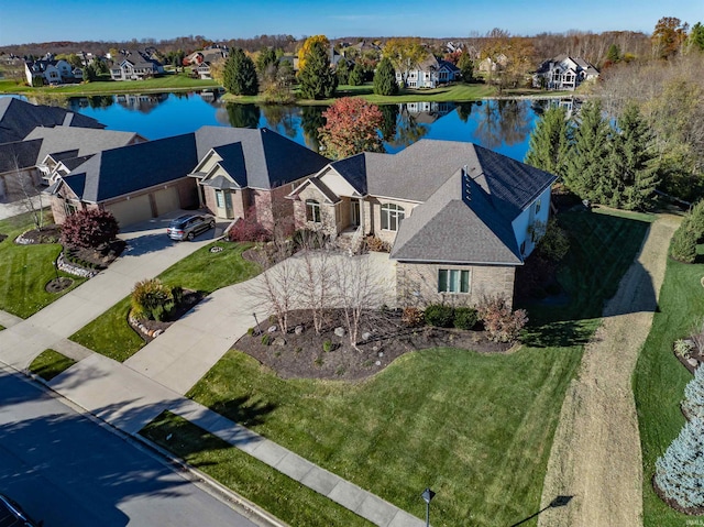 birds eye view of property with a water view