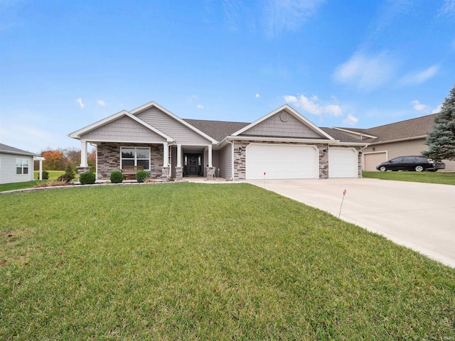 view of front of property featuring a garage and a front yard