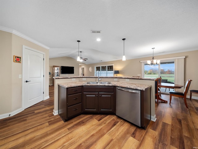 kitchen with a healthy amount of sunlight, dishwasher, dark brown cabinetry, sink, and dark hardwood / wood-style floors