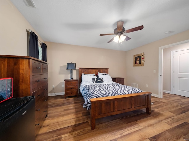 bedroom featuring light wood-type flooring and ceiling fan