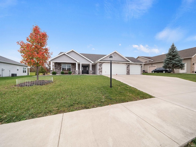 view of front of house with a front yard and a garage