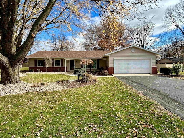 single story home with a front lawn and a garage