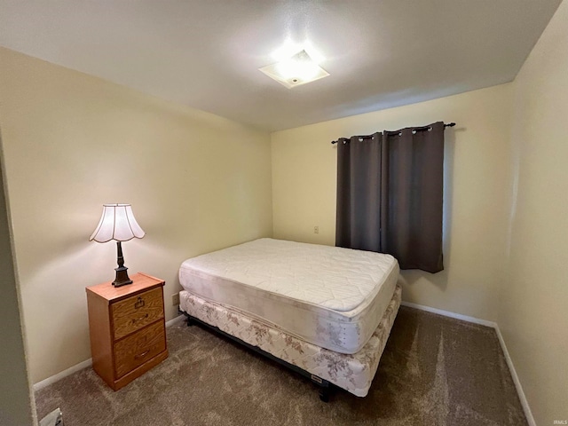 bedroom with dark carpet