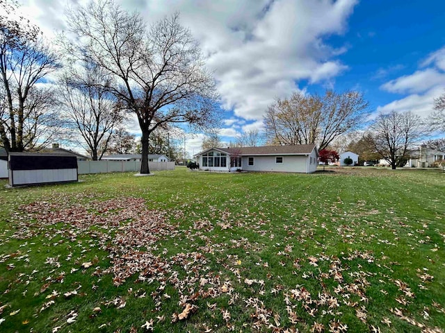 view of yard featuring a sunroom