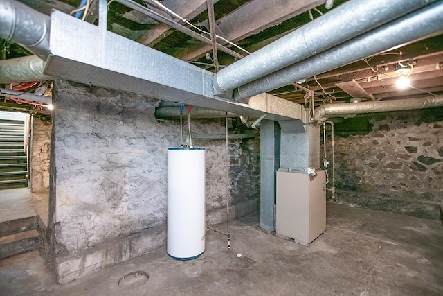 basement featuring water heater and heating unit