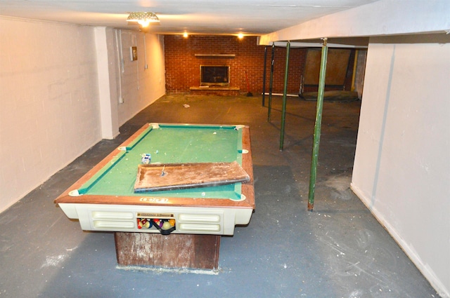 rec room featuring a fireplace, brick wall, and billiards