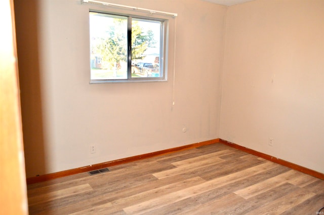 unfurnished room featuring light wood-type flooring