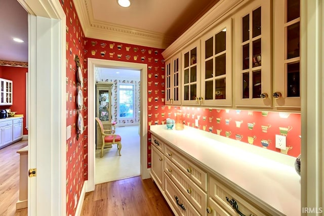 interior space with ornamental molding and light wood-type flooring