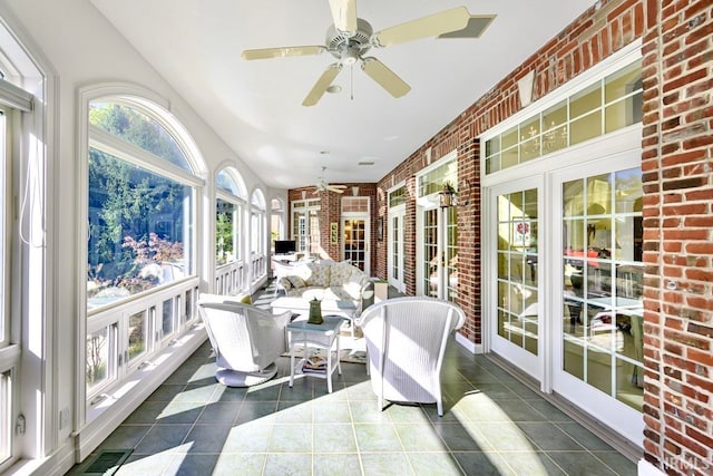 sunroom / solarium with ceiling fan