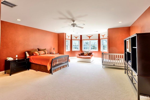 carpeted bedroom featuring ceiling fan