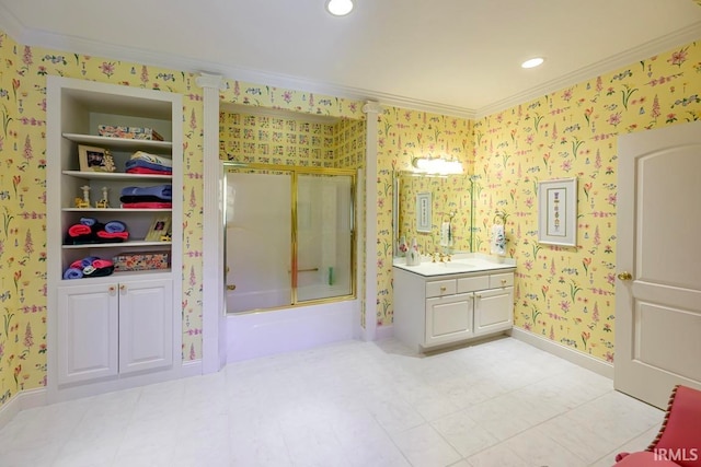 bathroom with shower / bath combination with glass door, built in features, vanity, and crown molding