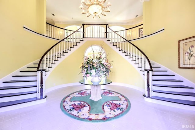 stairs featuring a chandelier and tile patterned floors