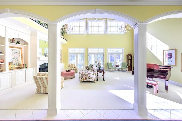 interior space with decorative columns and an inviting chandelier