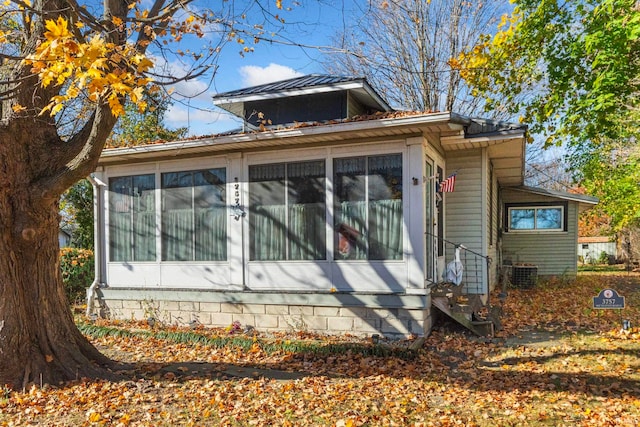 view of home's exterior featuring a sunroom